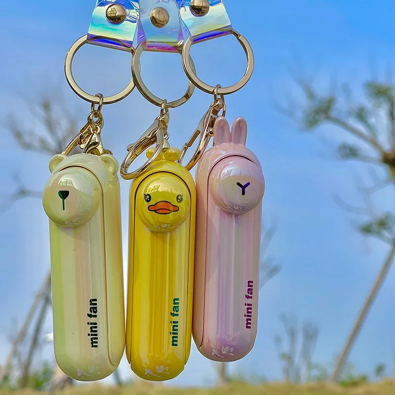 مروحة صغيرة محمولة USB – تصميم كيوت قابل للطي | تبريد للمكتب، السرير أو أثناء التنقل – بطارية قابلة للشحن