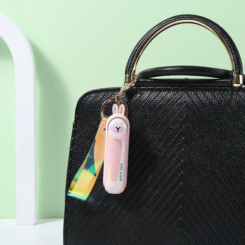 مروحة صغيرة محمولة USB – تصميم كيوت قابل للطي | تبريد للمكتب، السرير أو أثناء التنقل – بطارية قابلة للشحن